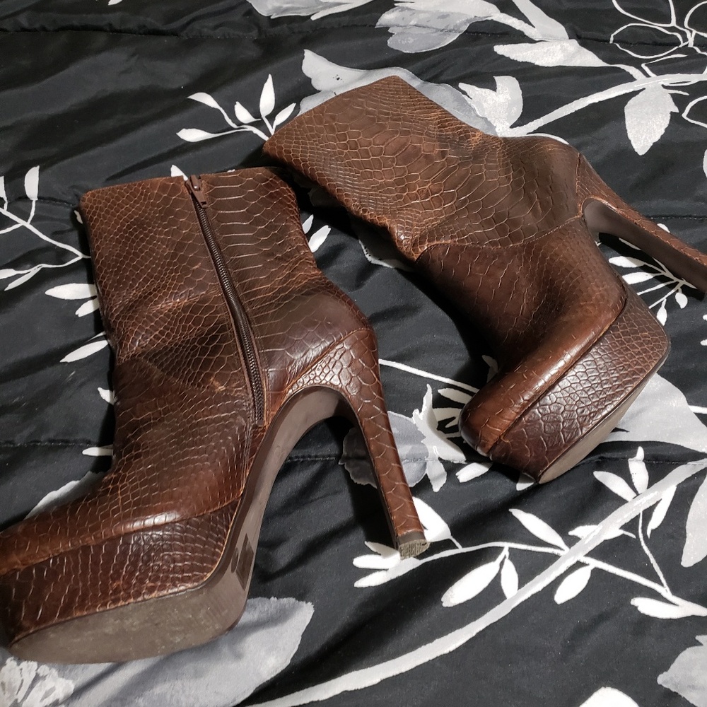 Brown snake skin heeled booties.